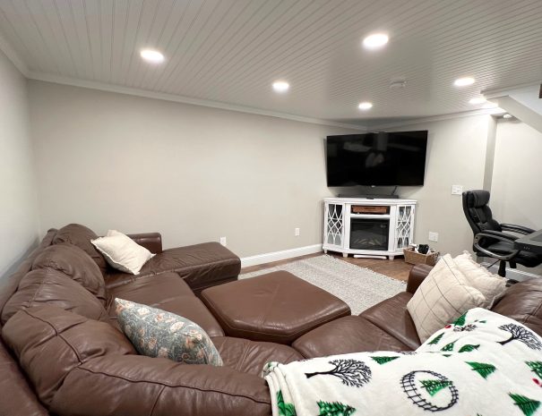 Basement - Sectional and TV at Driftaway vacation home beach rental by owner in Scarborough, Maine